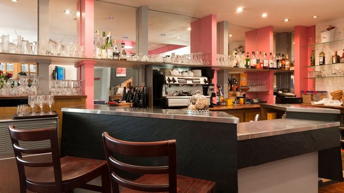 Bar stools in bar area at Hotel le cheval rouge