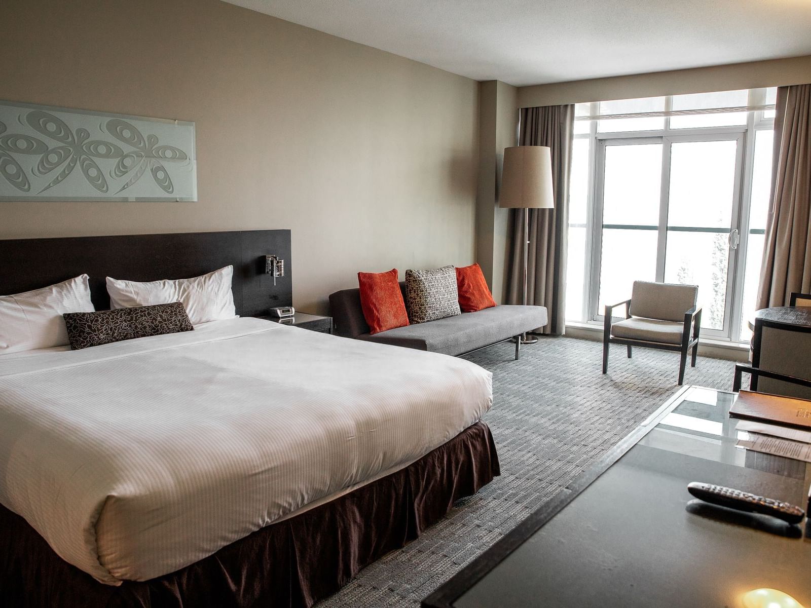 a bed and couch in a hotel room