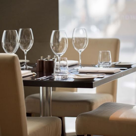 Dining table arranged in a Restaurant at Pullman Olympic park 