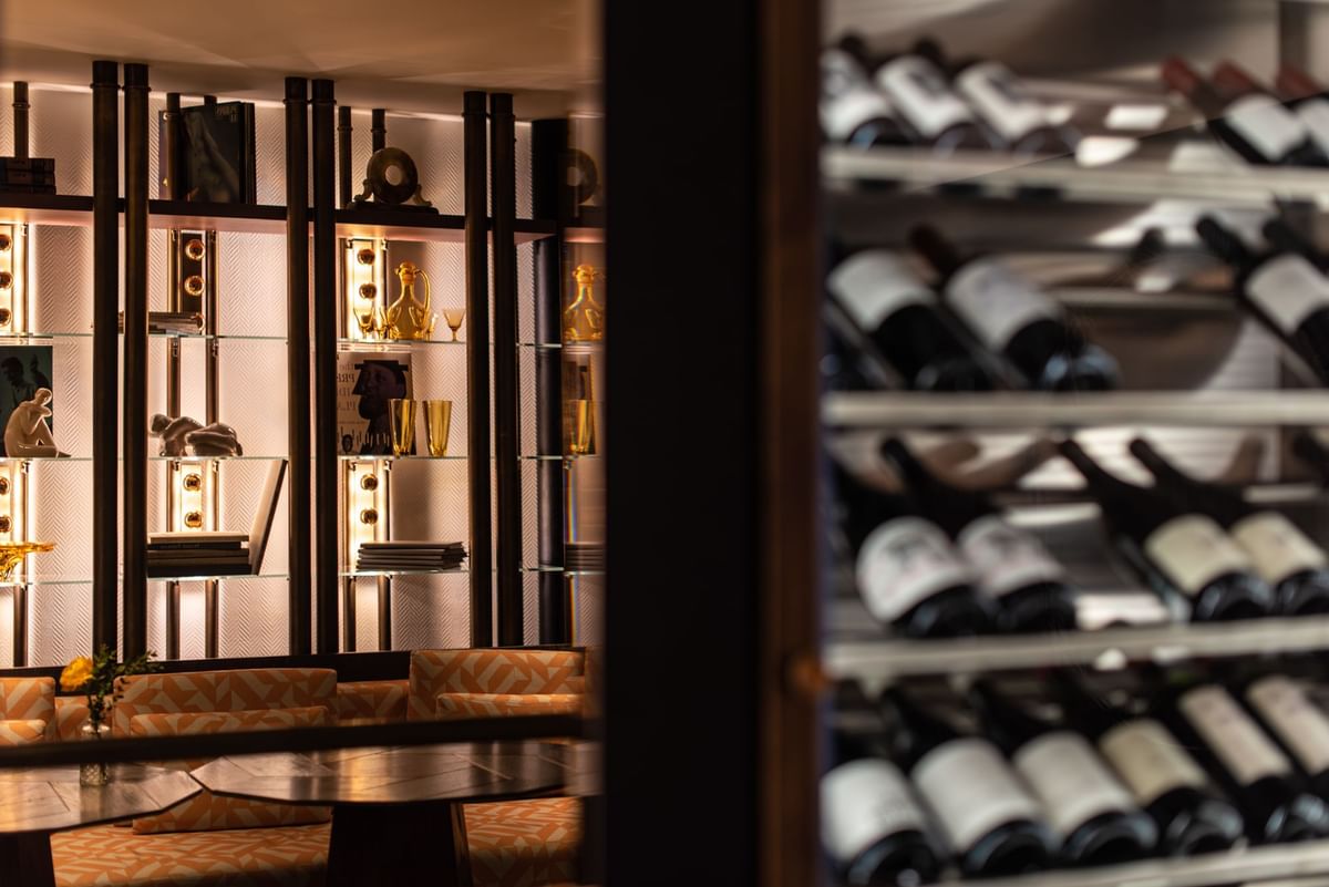 Shelf with bottles by the Bar counter at Almanac X Alcron Prague