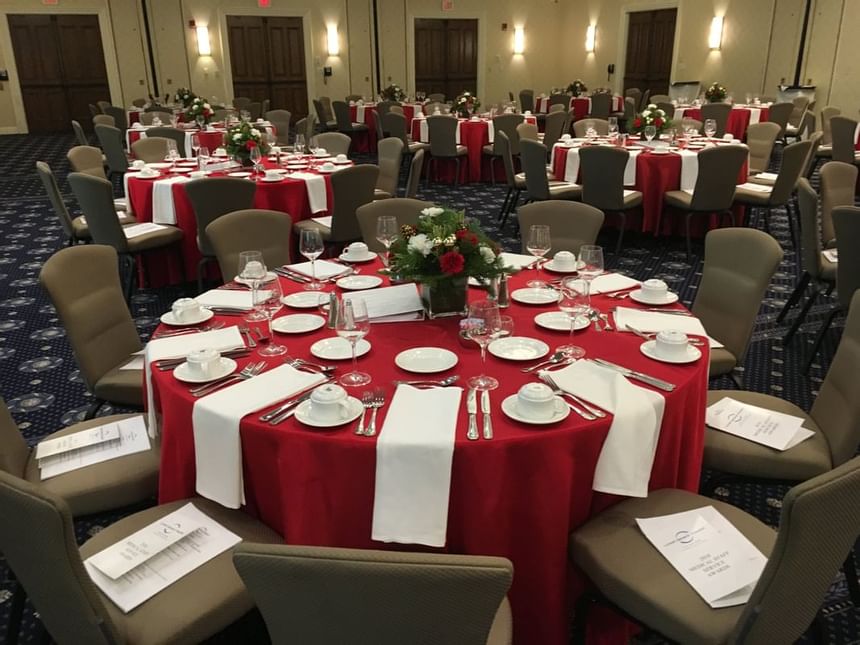 Banquet tables arranged for an event at UMass Lowell Inn