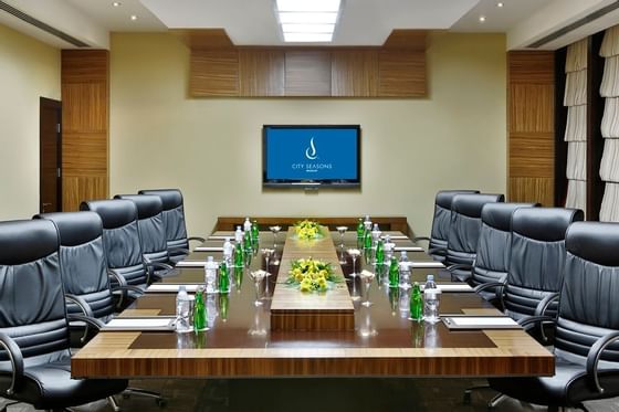 Boardroom table setup in Mutrah room at City Seasons Muscat