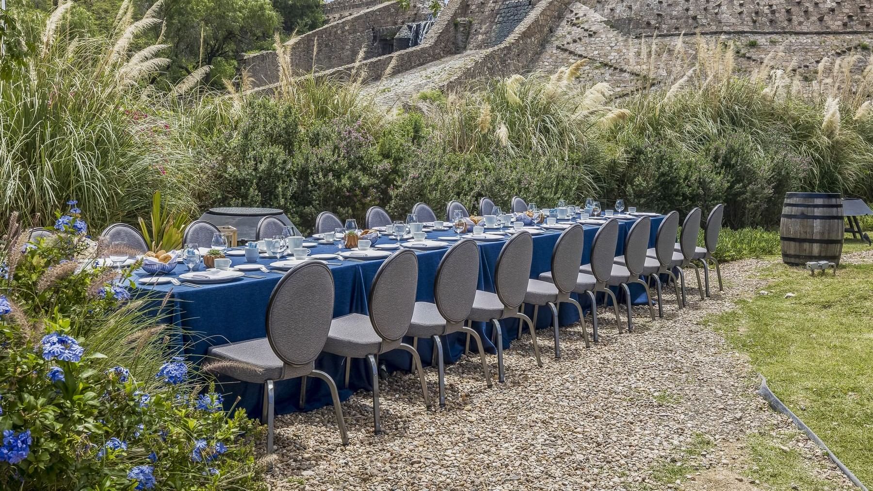 Royal dining table set up with glassware in an outdoor wedding venue at Live Aqua Resorts and Residence Club