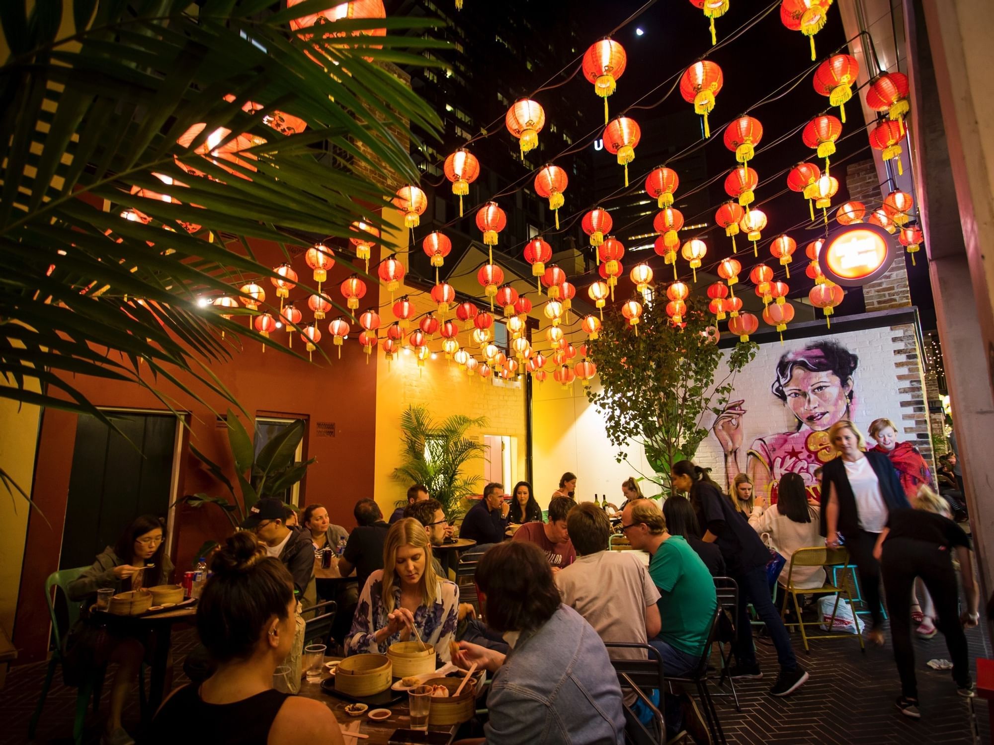 People dining in Spice Alley near Nesuto Hotels