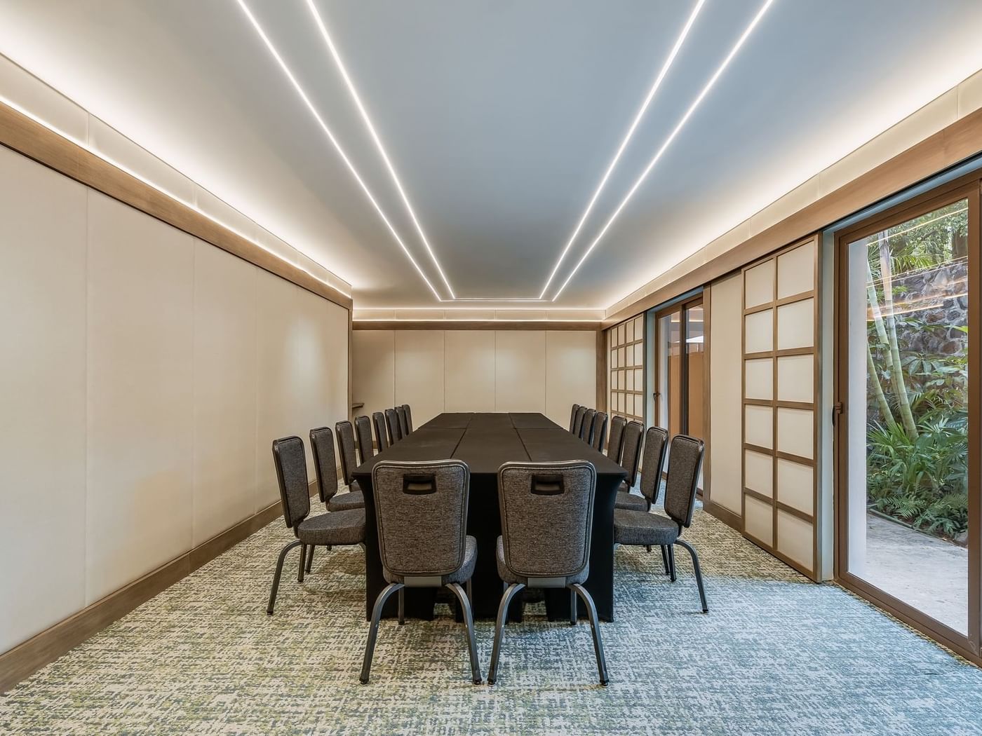 Modern tables and chairs arranged neatly in Salon 10 Meeting Room at Grand Fiesta Americana