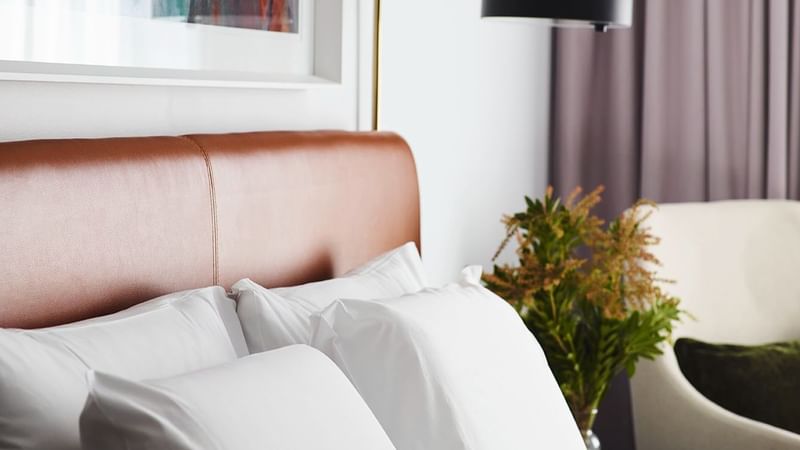 Close-up of pillows on a bed in a room at Novotel Sydney Darling Square