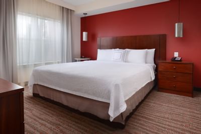 room with king bed and nightstand