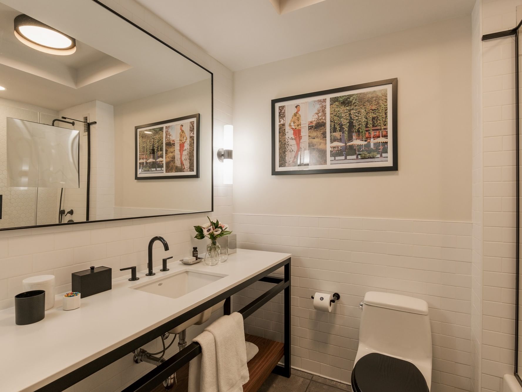 Modern bathroom with double sink, toilet, and large mirror at Gansevoort Meatpacking NYC in New York.