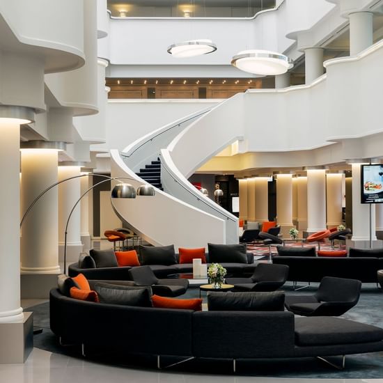 Lobby lounge area by the staircase at Pullman Albert Park