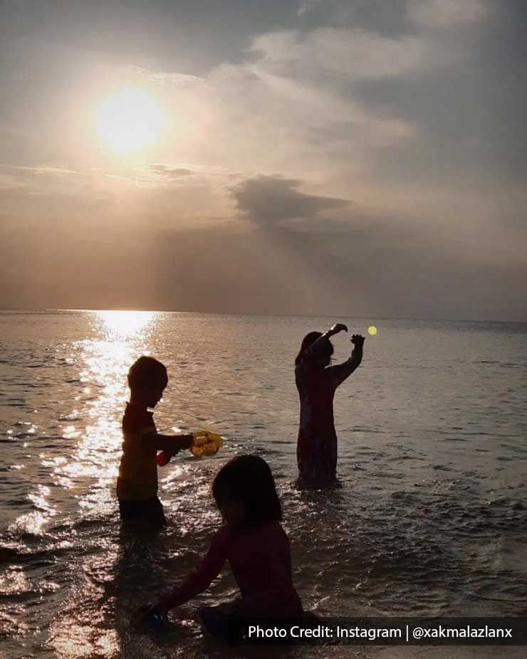 kids playing in the ocean