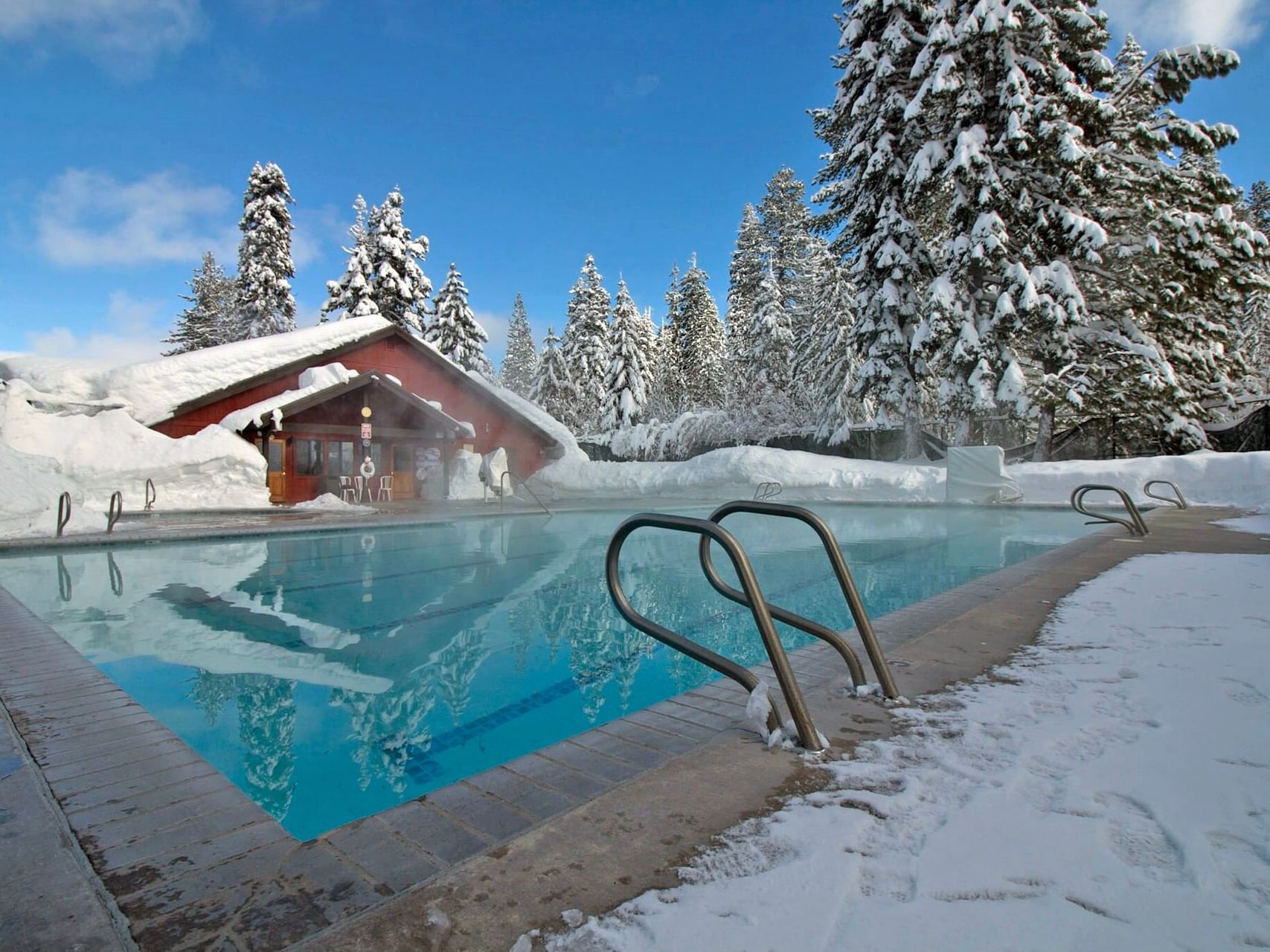 Outdoor pool with snow in winter at Granlibakken Tahoe