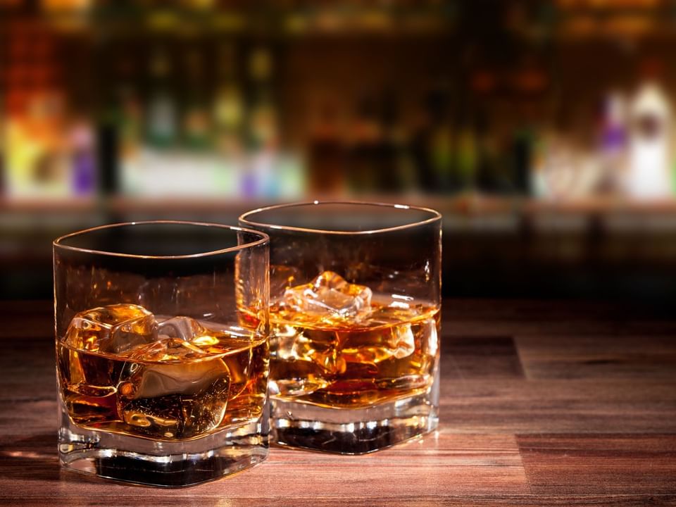 Close-up of two glasses of liquor served in Hightide Rooftop Bar at Las Casitas Village