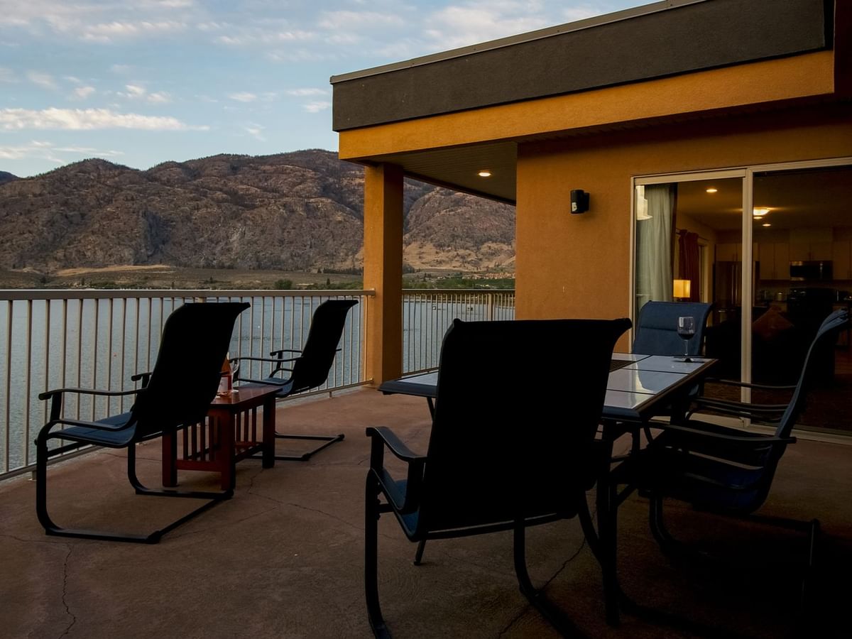 Patio lake view with furniture and mountains