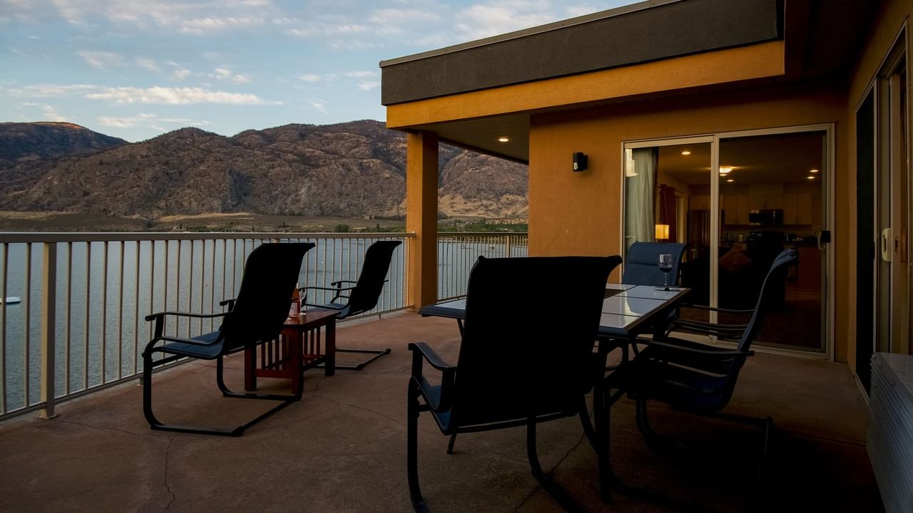 Patio lake view with furniture and mountains