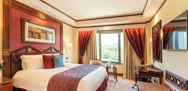Queen Bed & furniture in Deluxe Room at Nairobi Serena Hotel
