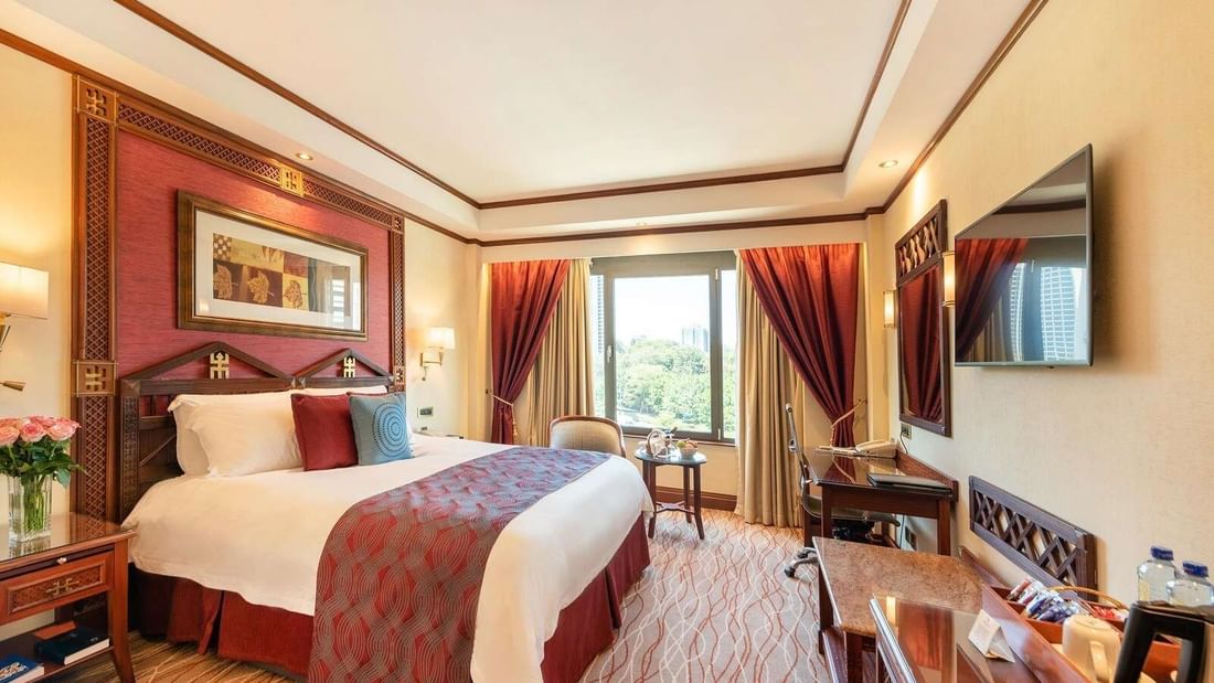 Queen Bed & furniture in Deluxe Room at Nairobi Serena Hotel
