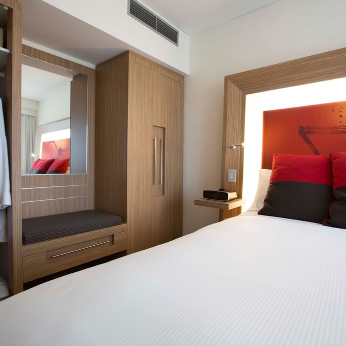 Bed & cupboard in Superior Spa Suites at Novotel Olympic Park