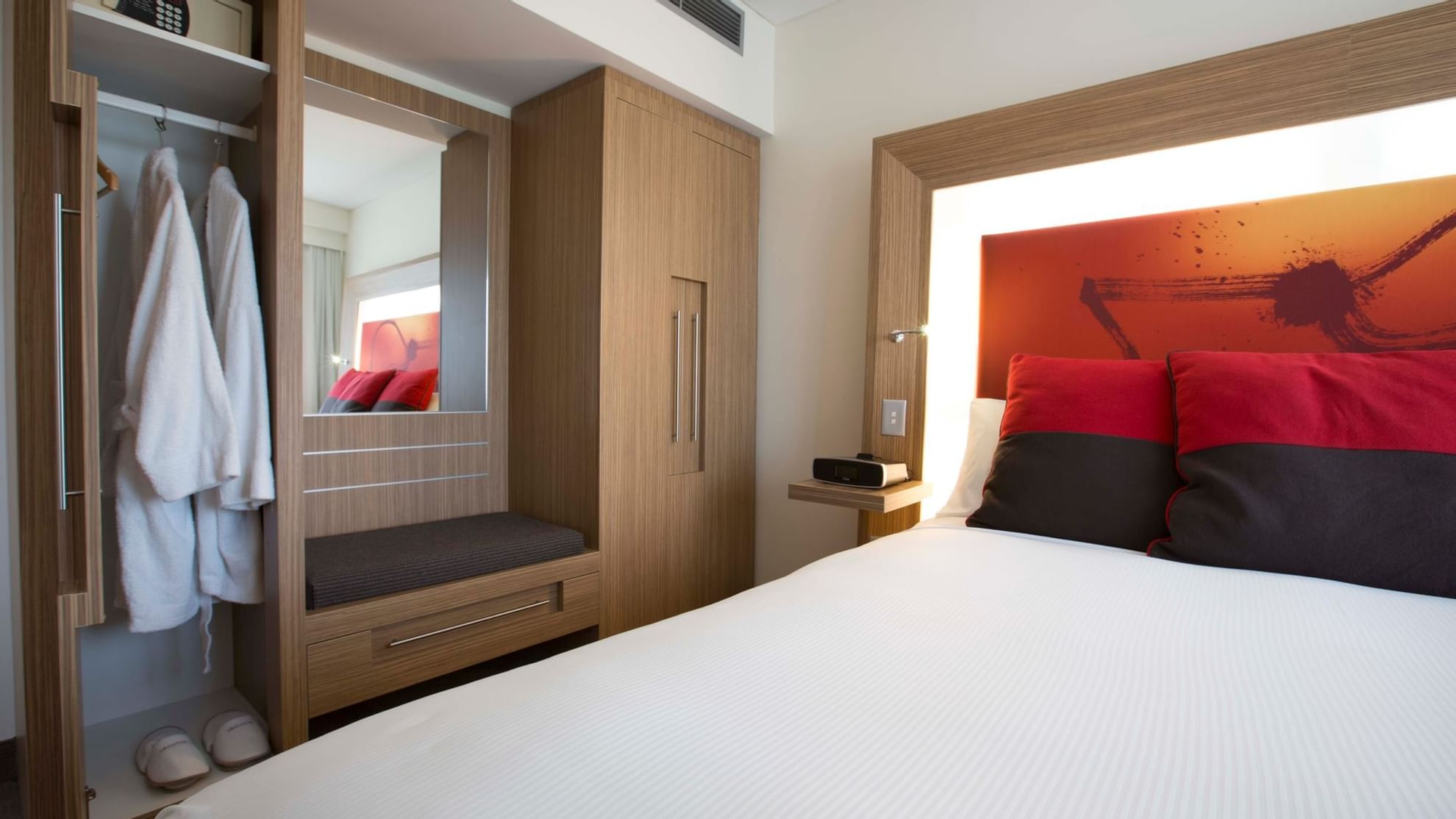 Bed & cupboard in Superior Spa Suites at Novotel Olympic Park