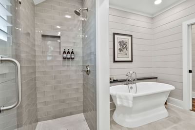 Modern Deluxe King Cottage bathroom with glass shower, bathtub, and minimalist decor by Cottages at Laurel Brooke