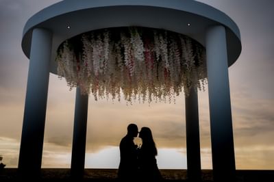 Couple kissing in the wedding aisle, Morgan Resort Spa Village