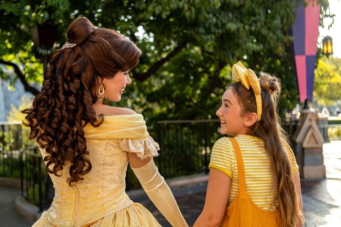 Princess Bella chatting with a girl in Disneyland near Anaheim Portofino Inn & Suites