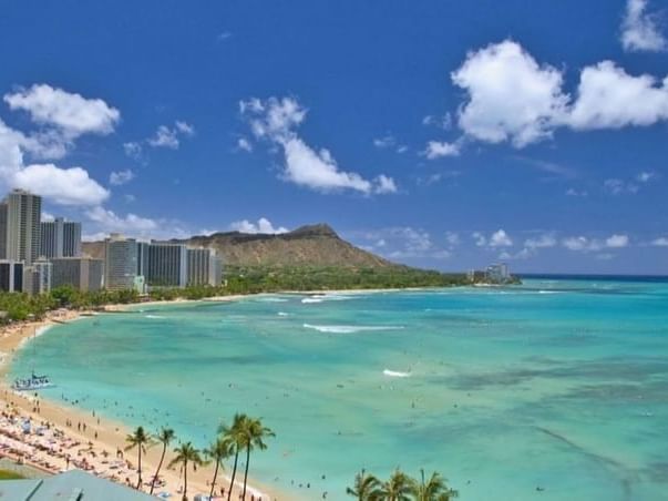 Distant view of Waikiki beach & shoreline on a sunny day near Paradise Bay Resort