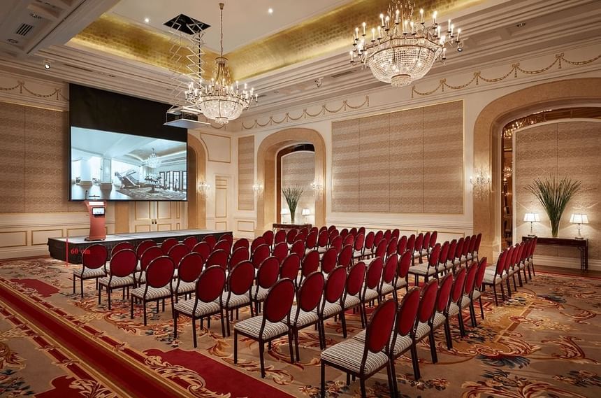 Chair arrangement in a Ballroom with an illuminated ceiling and carpeted floors at Park Hyatt Saigon