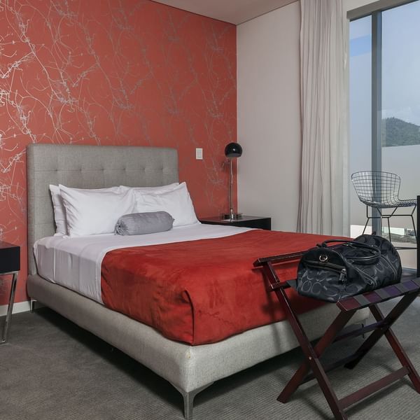Bed, stool & desk in the Junior Suite at Gamma Hotels