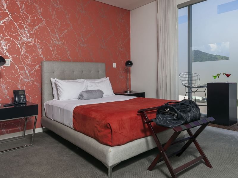 Bed, stool & desk in the Junior Suite at Gamma Hotels