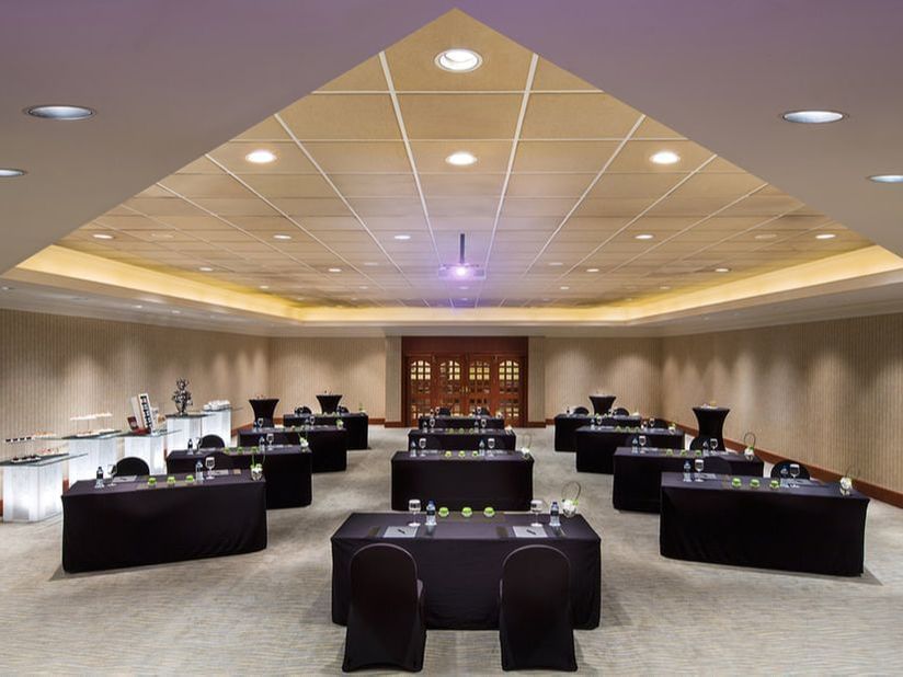 Interior view of table setup in a classroom at Ajman Hotel