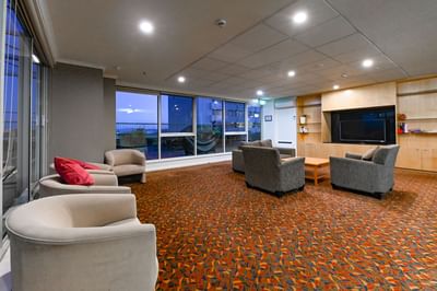 Loungers in the seating area at Nesuto Canberra Apartment Hotel