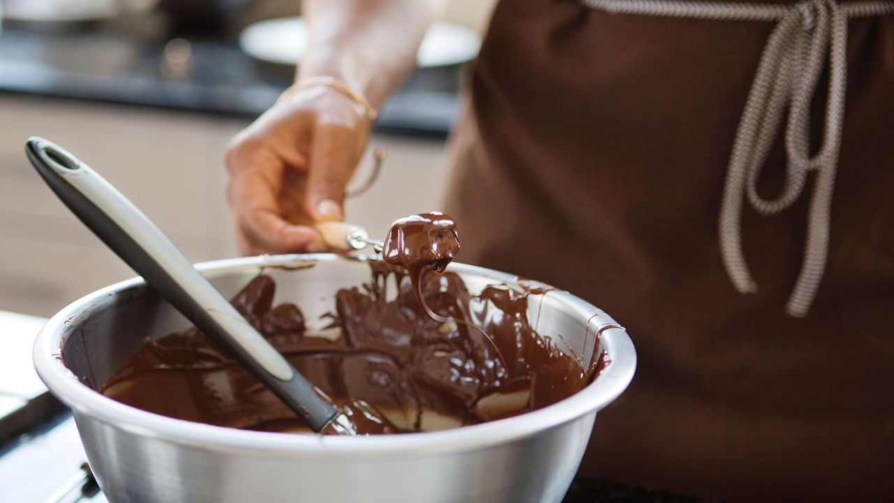 Melted chocolate in a metal bowl