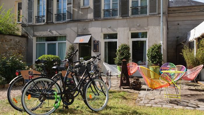 Mountain bikes parked in a garden at Hotel Victoria