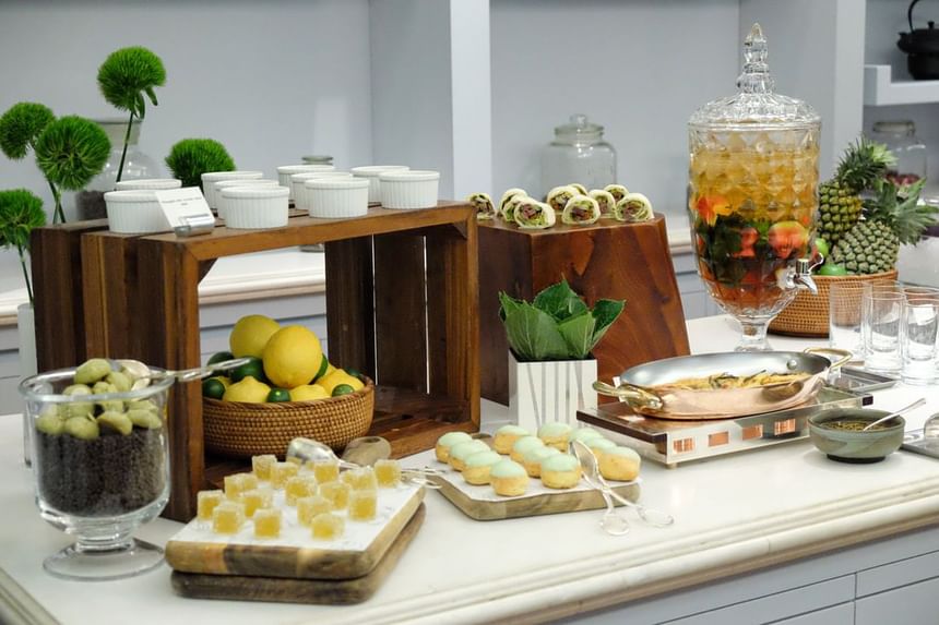 Elegant dessert display featuring floral arrangements, layered parfaits, pastries, and colorful treats at Park Hyatt Saigon