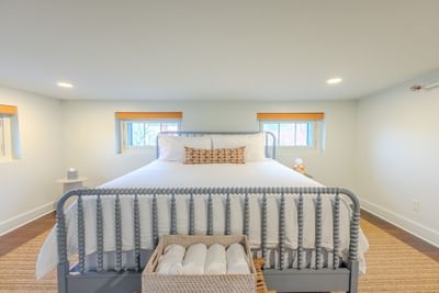Classic King Room with white bedding and nightstand at The Ashbrook Hotel