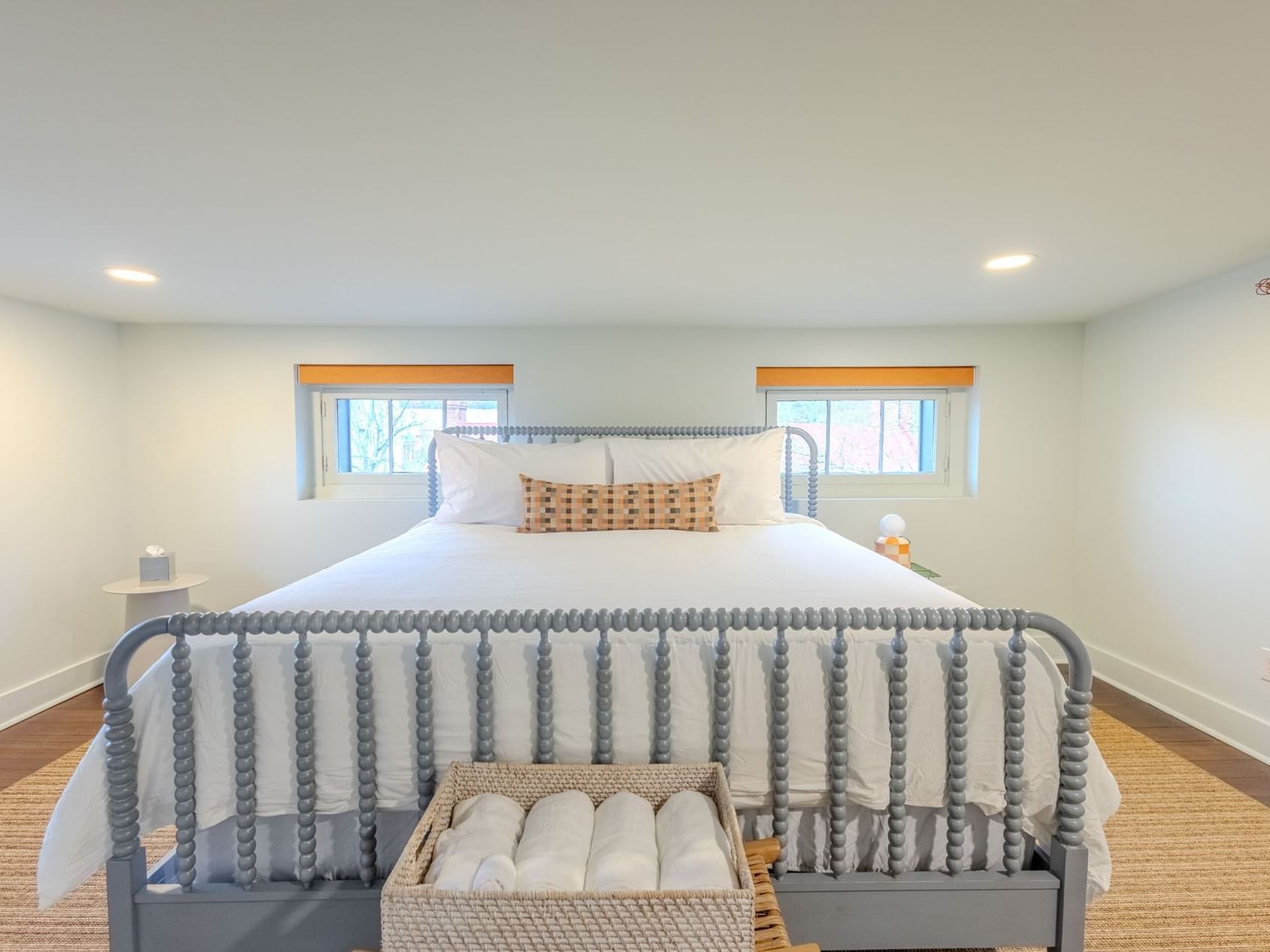 Classic King Accessible Room with white bedding and nightstand at The Ashbrook Hotel.