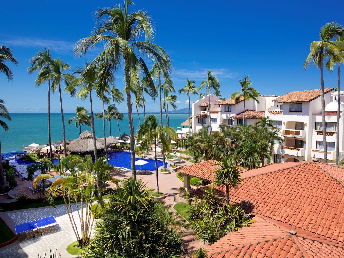 Pool, Beach and hotel exterior