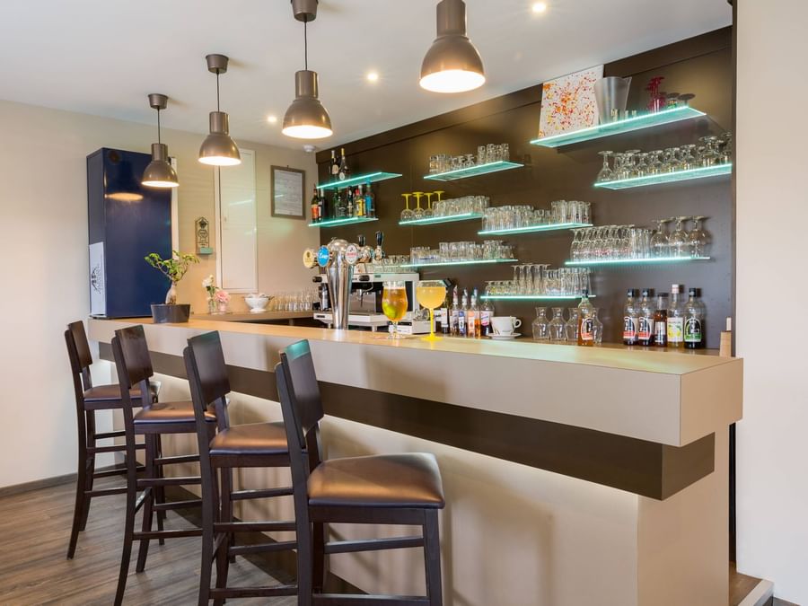 Barstools & display by bar counter at Le Relais des Carnutes