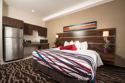 Accessibility Suite with a king bed at Encore Suites Grande Prairie