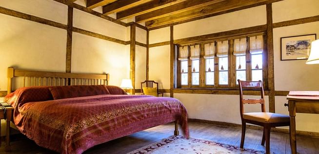 Interior of the Standard room bedroom at Serena Khaplu Palace