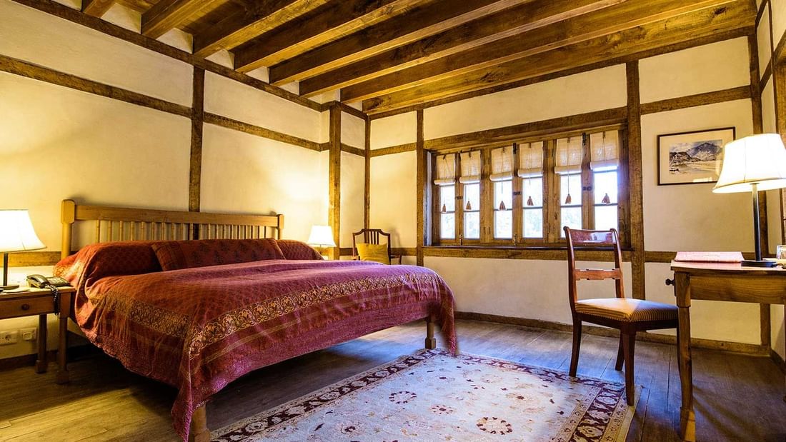 Interior of the Standard room bedroom at Serena Khaplu Palace