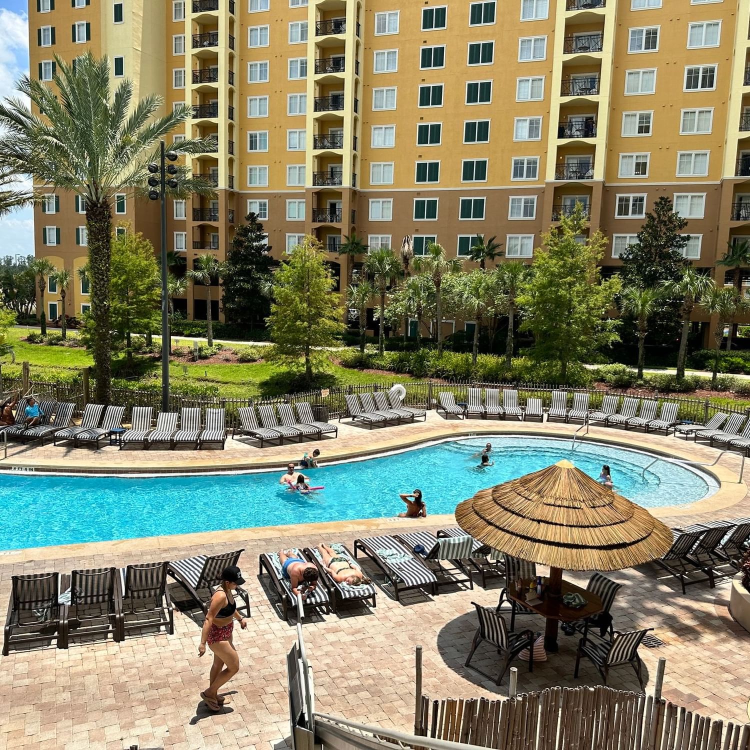 Pool area with sun loungers at Lake Buena Vista Resort Village and Spa