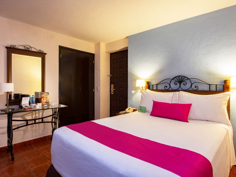 Powder table by the King bed in Studio Room at Gamma Hotels