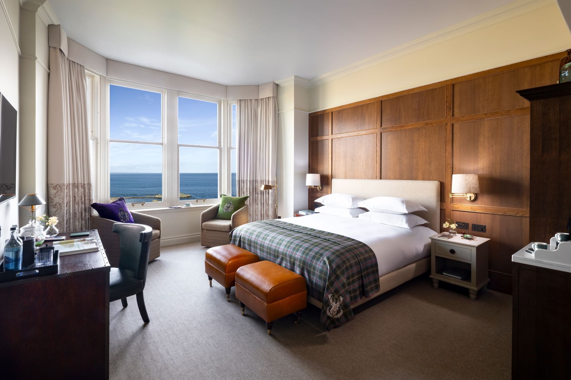 Suite With Sea View & Terrace, with a large bed, a plaid throw, and an ocean view from the window at Seaton House