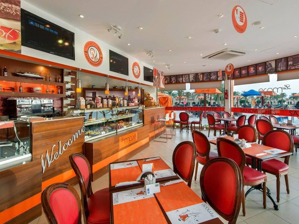 Dining table setup in a Restaurant at Mena Plaza Hotel
