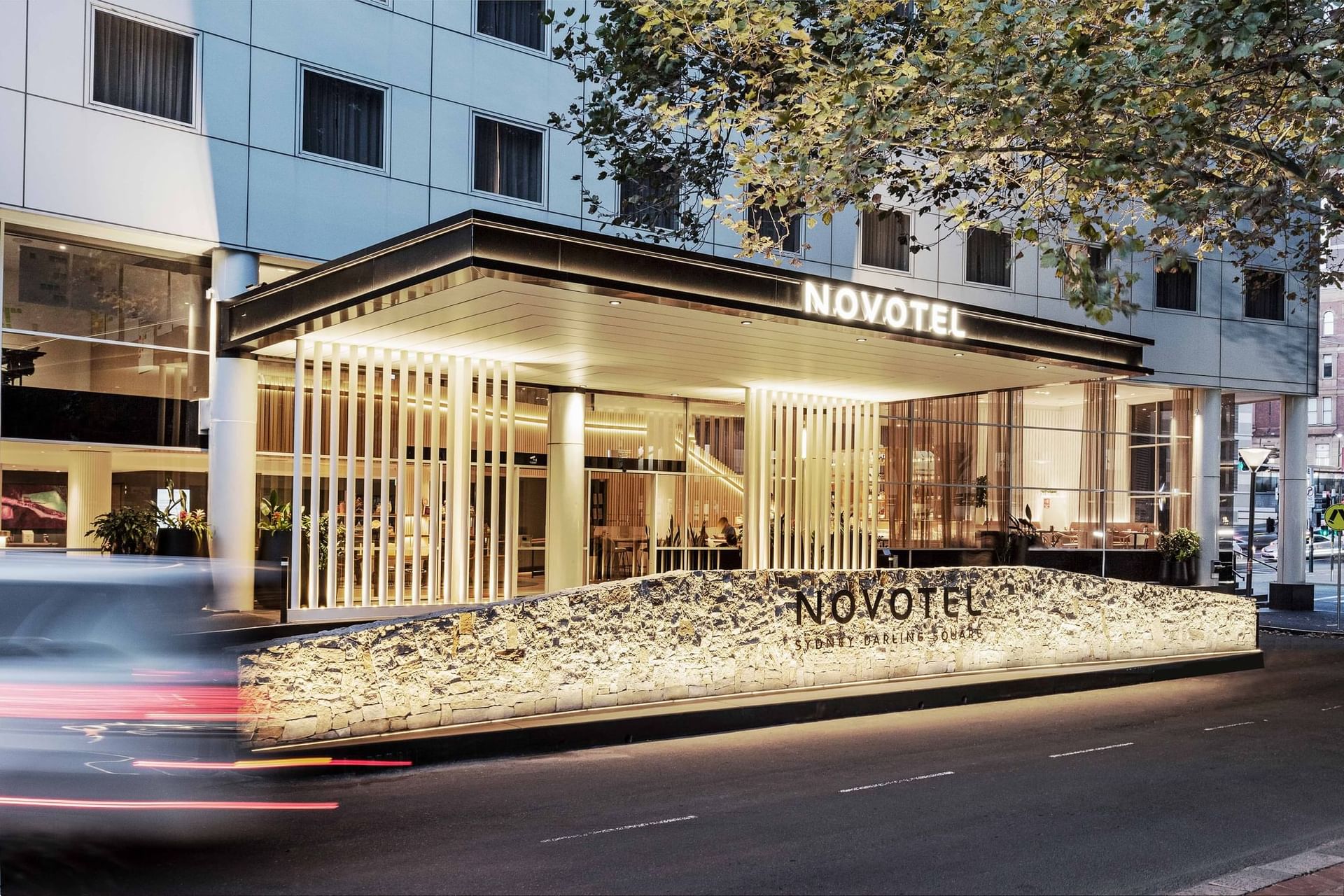 Illuminated exterior of Novotel Sydney Darling Square