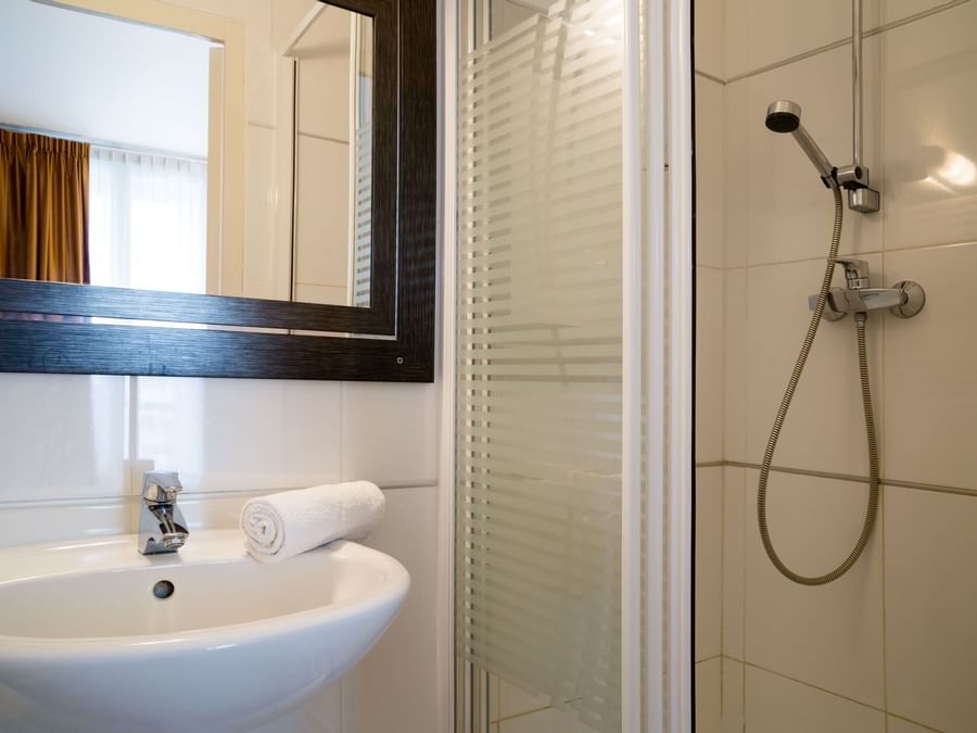 Bathroom vanity in bedrooms at Hotel du Grand Monarque