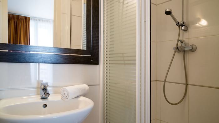 Bathroom vanity in bedrooms at Hotel du Grand Monarque