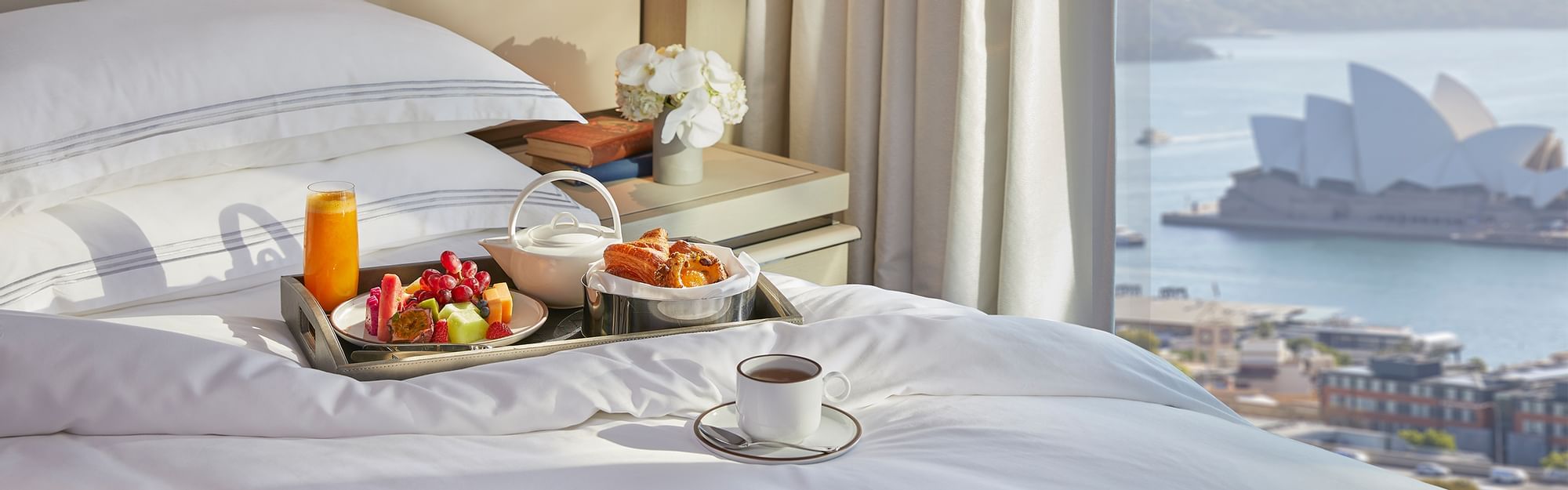 A bedroom with the Opera House view at Crown Towers Sydney