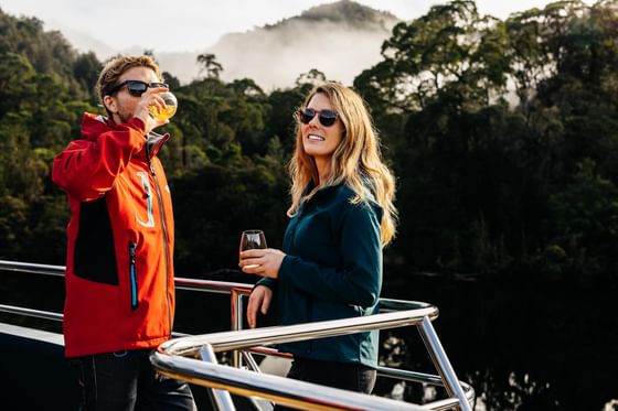 Couple on a vessel in the Gordon River near Strahan Village